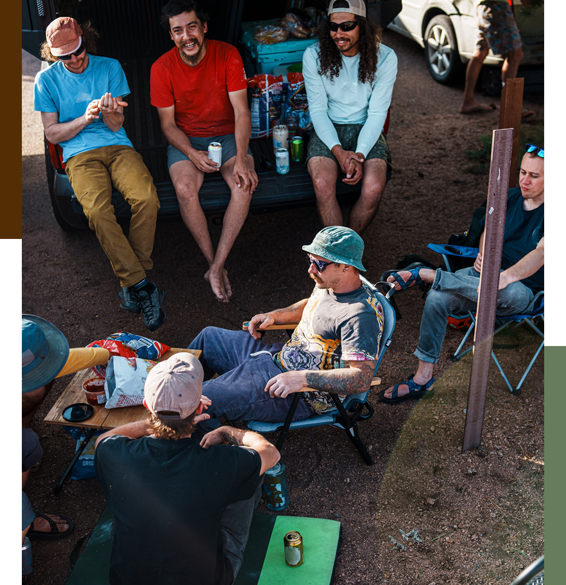 Group of friends relaxing by parked car.