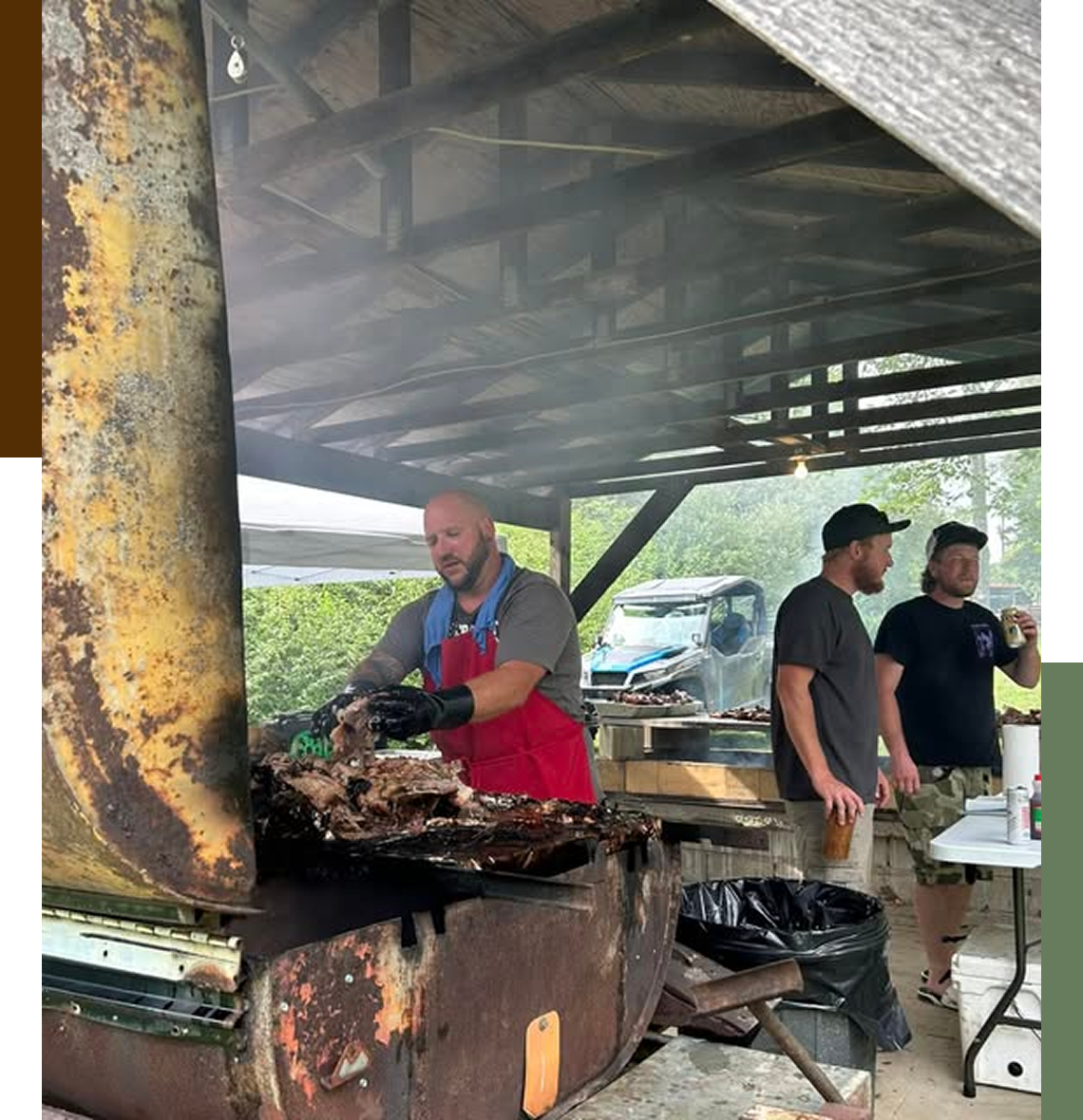 Man cooking meat on outdoor grill.